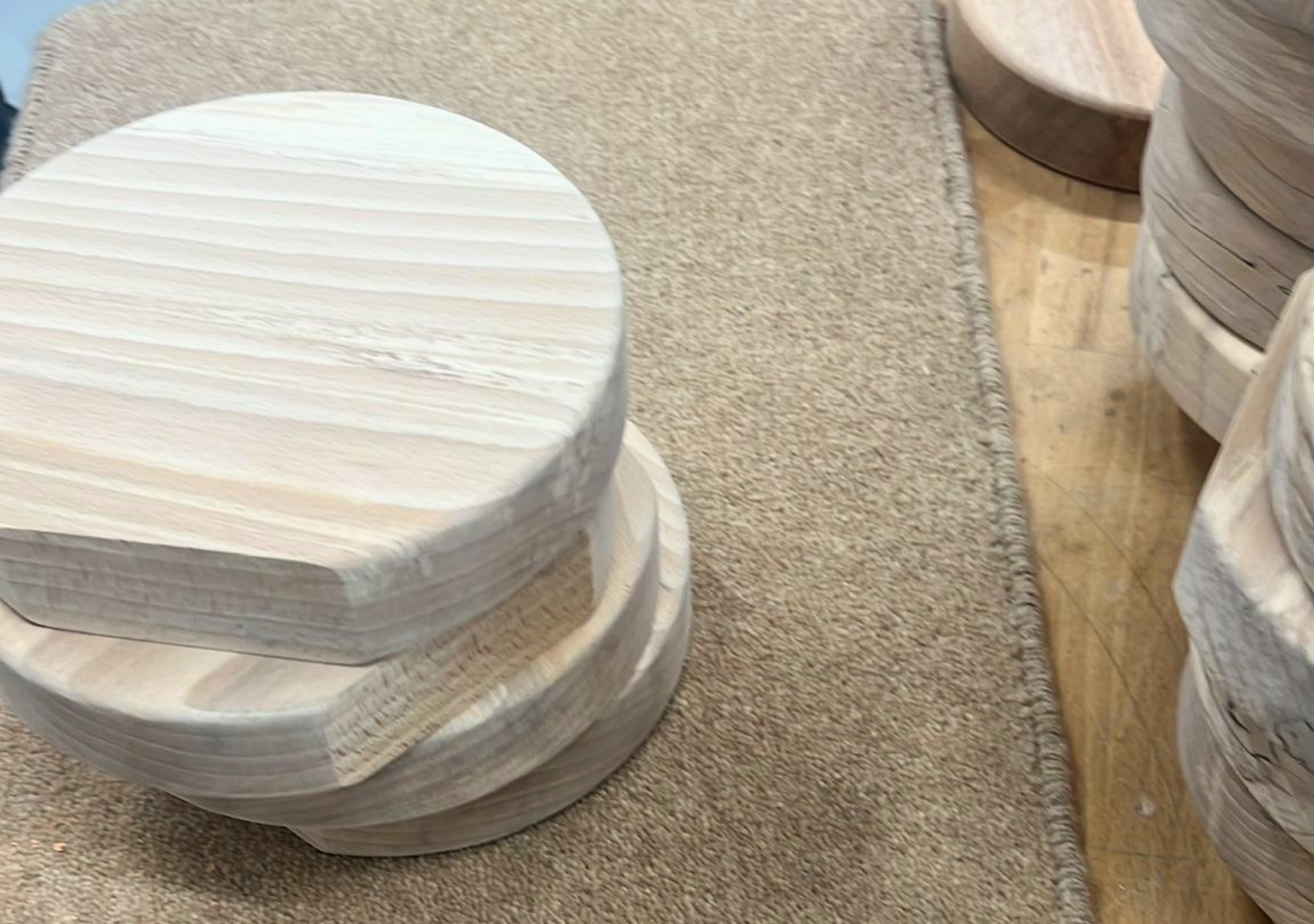 Shaped wooden trophy pieces being prepared before engraving and finishing
