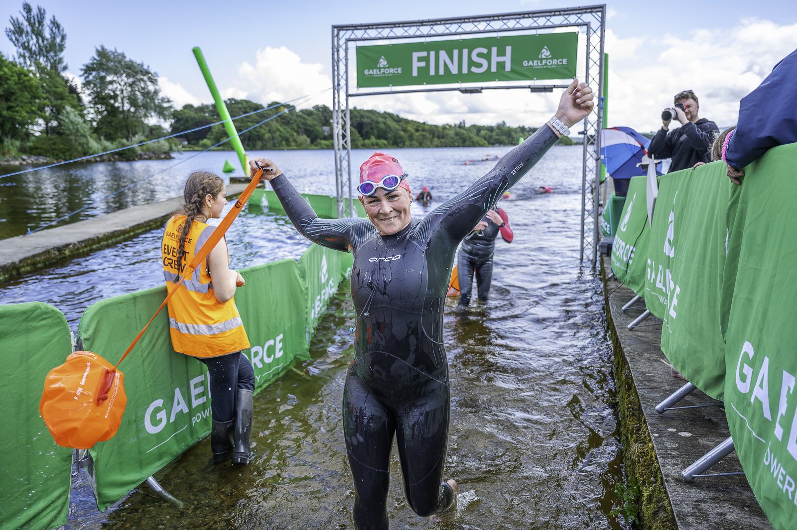 Swimmer finishing the Gaelforce Great Lake Swim Festival freshwater swimming event
